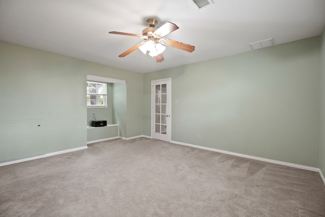 111 Whispering Oaks Dr, Seabrook, TX 77586 - empty room with carpet, baseboards, and a ceiling fan