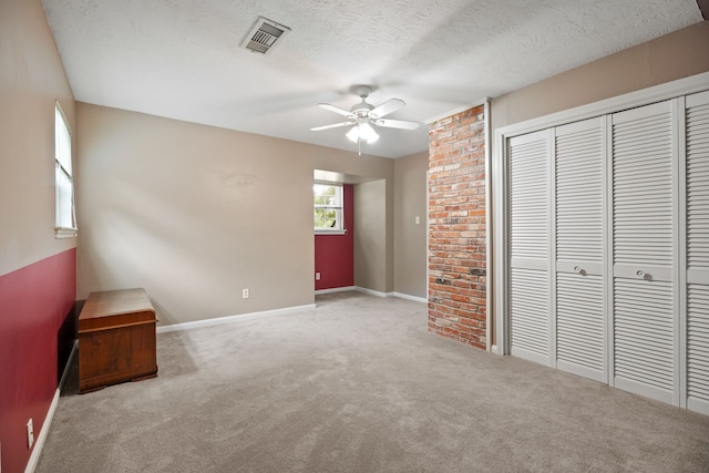 111 Whispering Oaks Dr, Seabrook, TX 77586 - unfurnished bedroom featuring a closet, carpet floors, baseboards, a textured ceiling, and ceiling fan