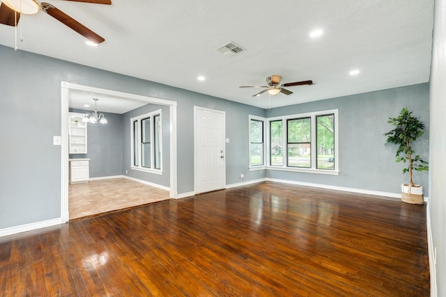 411 Southern Oaks Dr, Lake Jackson, TX 77566 - unfurnished room featuring a ceiling fan, wood finished floors, baseboards, recessed lighting, and a chandelier