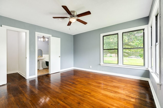 411 Southern Oaks Dr, Lake Jackson, TX 77566 - unfurnished bedroom with multiple windows, wood-type flooring, and baseboards