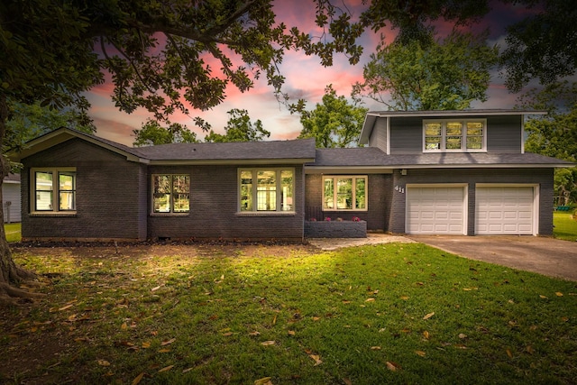 411 Southern Oaks Dr, Lake Jackson, TX 77566 - view of front of home with driveway, a garage, a front yard, and brick siding