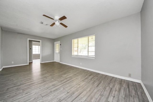 141 E Twickenham Trl, Houston, TX 77076 - empty room featuring ceiling fan, wood finished floors, and baseboards