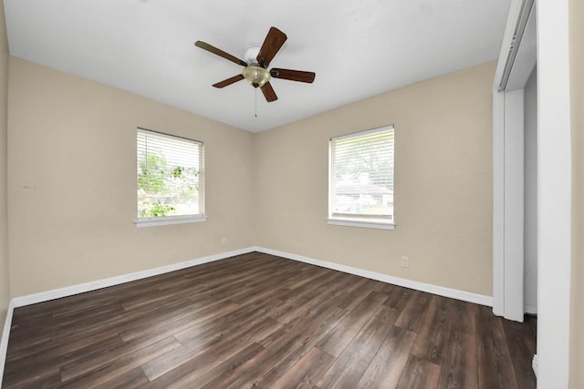 141 E Twickenham Trl, Houston, TX 77076 - unfurnished bedroom with dark wood finished floors, baseboards, and ceiling fan