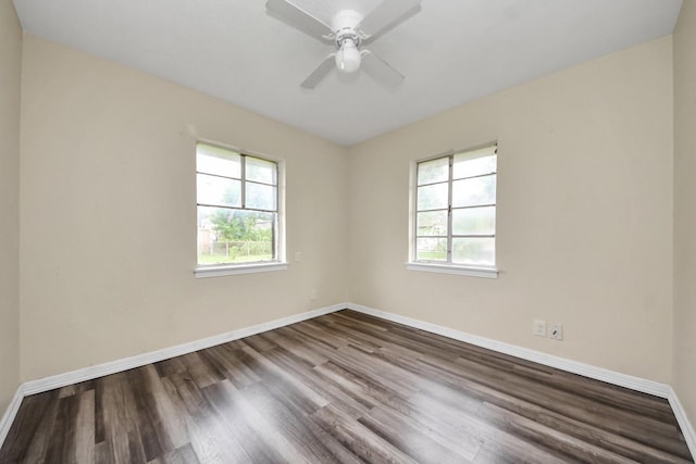 141 E Twickenham Trl, Houston, TX 77076 - empty room with healthy amount of natural light, dark wood finished floors, and ceiling fan