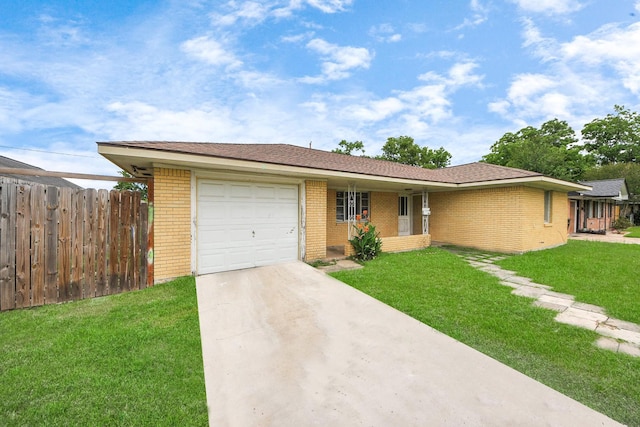 141 E Twickenham Trl, Houston, TX 77076 - single story home with an attached garage, brick siding, and driveway