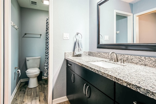 17626 Heritage Creek Dr, Webster, TX 77598 - full bath with wood finished floors, vanity, baseboards, and toilet