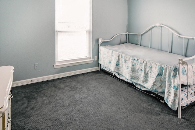 17626 Heritage Creek Dr, Webster, TX 77598 - bedroom with dark carpet and baseboards
