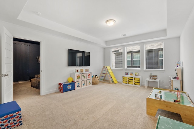 24407 Green Buffalograss Trl, Katy, TX 77493 - playroom with a tray ceiling, carpet floors, and baseboards