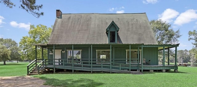 10 Walnut Loop, Shepherd, TX 77371 - rear view of property featuring a yard, a chimney, and board and batten siding