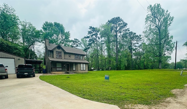 10 Walnut Loop, Shepherd, TX 77371 - view of front of home featuring a front lawn, a chimney, driveway, a detached garage, and an outdoor structure