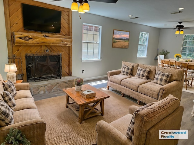 10 Walnut Loop, Shepherd, TX 77371 - living area with a ceiling fan, healthy amount of natural light, wood finished floors, and recessed lighting