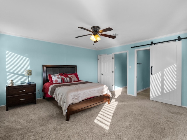 1210 Island Dr, San Leon, TX 77539 - carpeted bedroom with a barn door, crown molding, ceiling fan, and baseboards