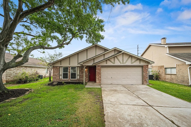 1043 Sierra Shadows Dr, Katy, TX 77450 - tudor house featuring a garage, concrete driveway, a front yard, and brick siding