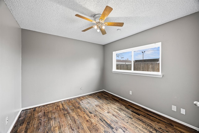 1043 Sierra Shadows Dr, Katy, TX 77450 - empty room with wood finished floors, baseboards, a textured ceiling, and a ceiling fan