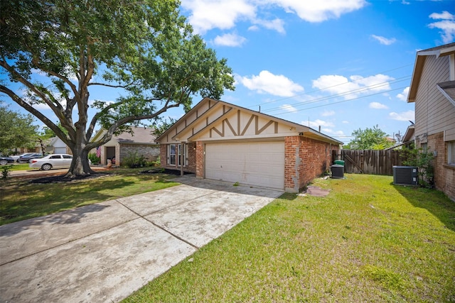 1043 Sierra Shadows Dr, Katy, TX 77450 - view of front of house with brick siding, central AC, and a detached garage