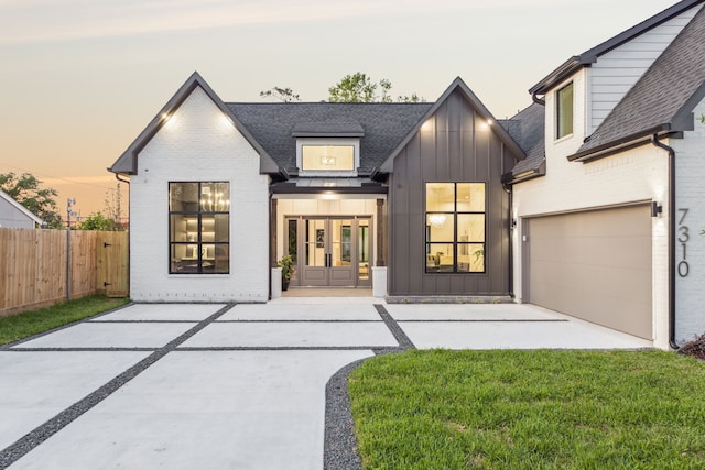 7310 Jalna St, Houston, TX 77055 - modern farmhouse style home with board and batten siding, french doors, driveway, a garage, and a shingled roof