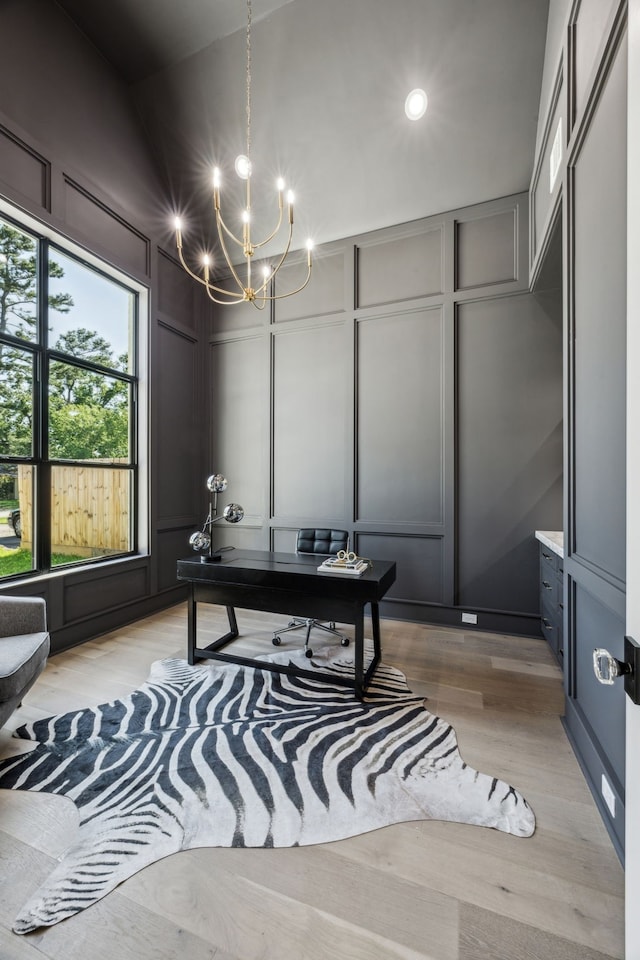 7310 Jalna St, Houston, TX 77055 - office area featuring a decorative wall, a chandelier, vaulted ceiling, light wood-style floors, and recessed lighting