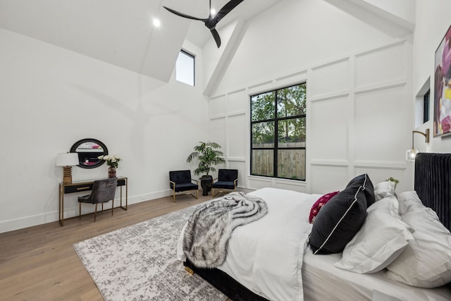 7310 Jalna St, Houston, TX 77055 - bedroom featuring high vaulted ceiling, baseboards, wood finished floors, and beamed ceiling