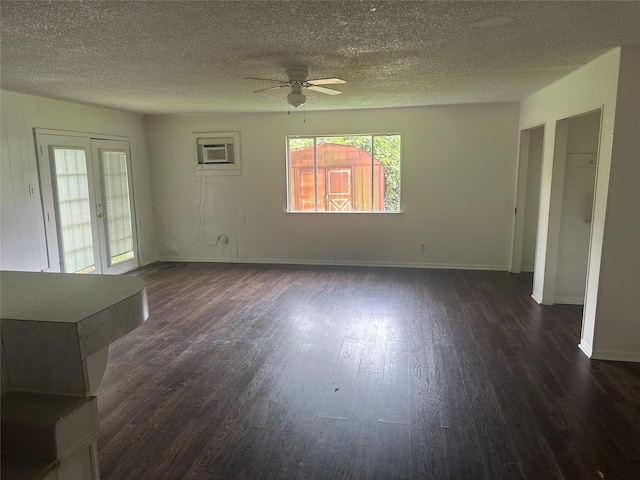 3118 Dacca Dr, Houston, TX 77051 - unfurnished living room with a ceiling fan, dark wood finished floors, a textured ceiling, baseboards, and a wall mounted air conditioner