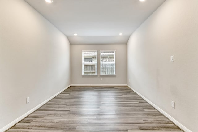 1210 Oak Barrel Run, Richmond, TX 77406 - spare room featuring recessed lighting, wood finished floors, and baseboards