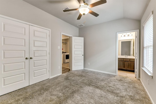 1210 Oak Barrel Run, Richmond, TX 77406 - unfurnished bedroom featuring carpet flooring, a closet, lofted ceiling, ensuite bath, and baseboards