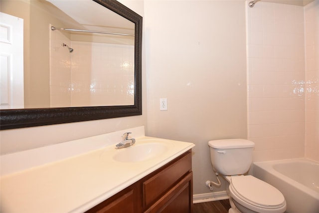 9619 Babbling Spring Ct, Tomball, TX 77375 - bathroom featuring toilet, vanity, baseboards, tub / shower combination, and wood finished floors