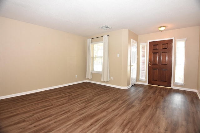 9619 Babbling Spring Ct, Tomball, TX 77375 - foyer featuring dark wood-style floors and baseboards