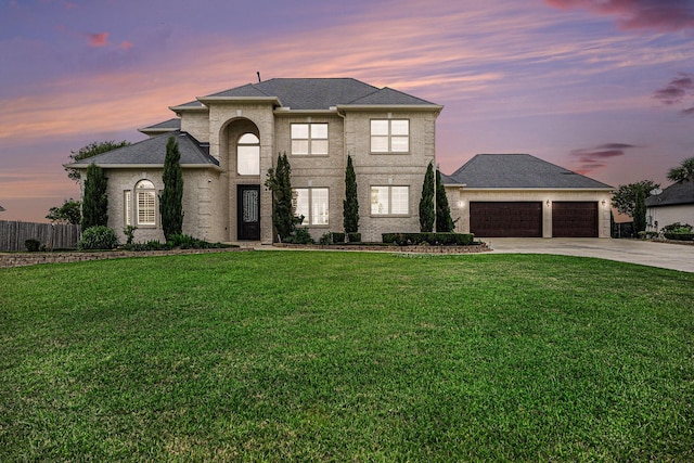 11503 Kings Point Blvd, Mont Belvieu, TX 77535 - french provincial home featuring driveway, an attached garage, and roof with shingles