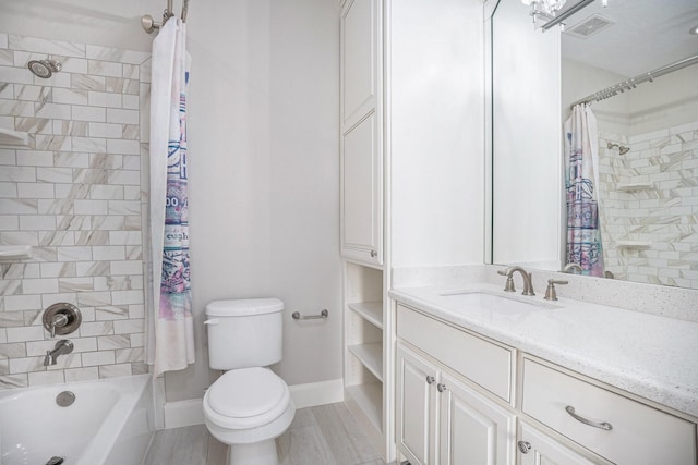 11503 Kings Point Blvd, Mont Belvieu, TX 77535 - bathroom featuring shower / bath combo, vanity, toilet, and baseboards