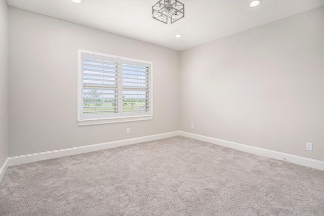 11503 Kings Point Blvd, Mont Belvieu, TX 77535 - carpeted empty room with recessed lighting and baseboards