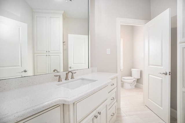11503 Kings Point Blvd, Mont Belvieu, TX 77535 - bathroom featuring vanity, toilet, and baseboards