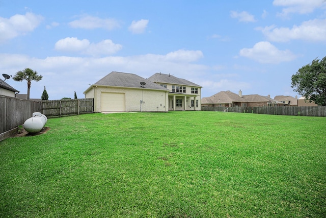 11503 Kings Point Blvd, Mont Belvieu, TX 77535 - rear view of property with an attached garage