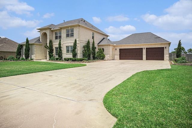 11503 Kings Point Blvd, Mont Belvieu, TX 77535 - french country style house featuring driveway, an attached garage, and brick siding