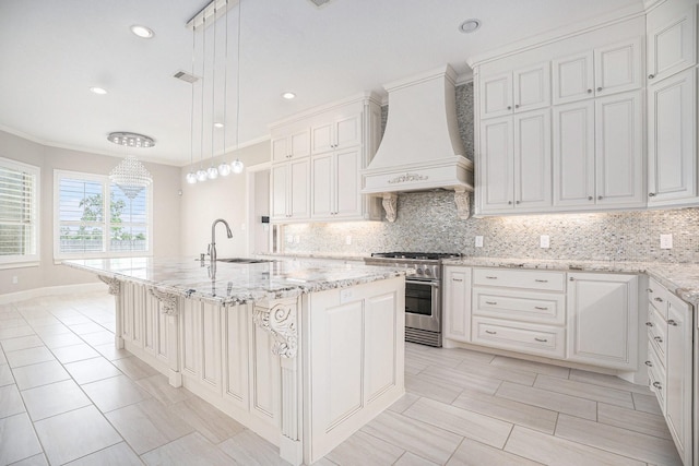 11503 Kings Point Blvd, Mont Belvieu, TX 77535 - kitchen with high end stove, custom range hood, a sink, decorative backsplash, and light stone countertops