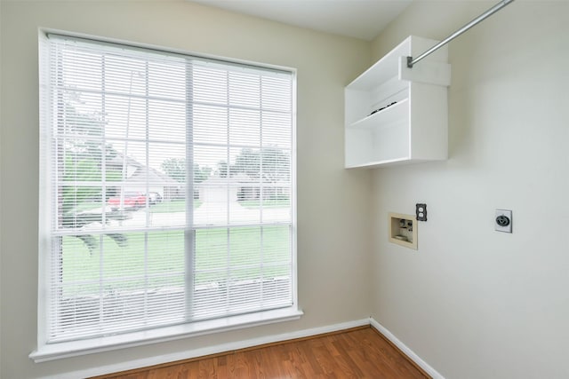4614 Russett Pl S, Pearland, TX 77584 - laundry room with hookup for a washing machine, baseboards, healthy amount of natural light, and electric dryer hookup