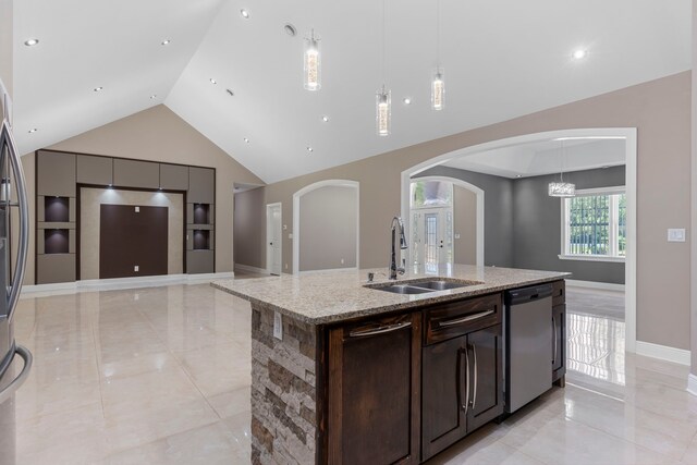 17501 Julianne Dr, Waller, TX 77484 - kitchen featuring a sink, dishwasher, arched walkways, an island with sink, and built in features