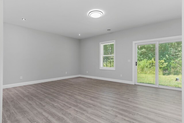 17501 Julianne Dr, Waller, TX 77484 - spare room with wood finished floors, baseboards, and recessed lighting