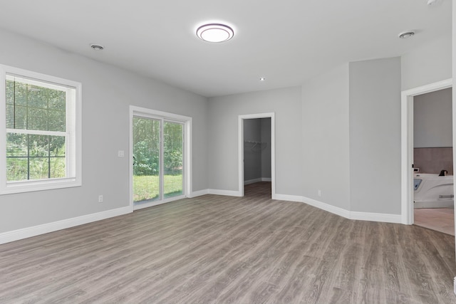 17501 Julianne Dr, Waller, TX 77484 - spare room featuring wood finished floors and baseboards