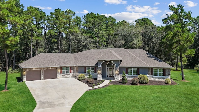 17501 Julianne Dr, Waller, TX 77484 - view of front of home featuring a garage, stone siding, and a front yard