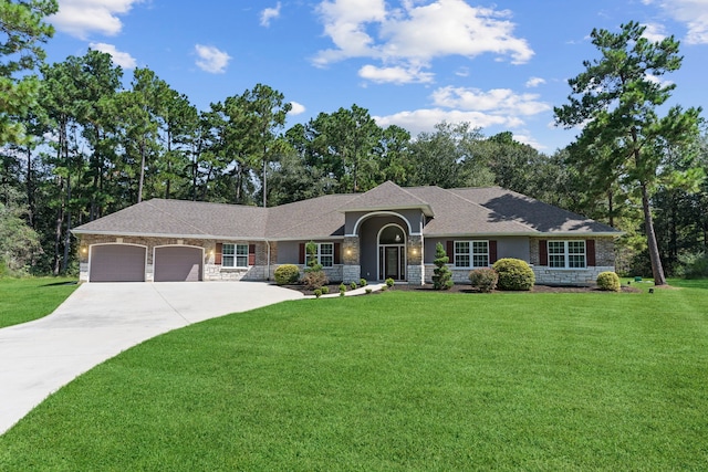 17501 Julianne Dr, Waller, TX 77484 - ranch-style house with a garage, a front lawn, stone siding, and concrete driveway