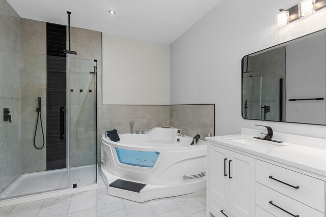 17501 Julianne Dr, Waller, TX 77484 - full bathroom featuring a stall shower, marble finish floors, vanity, a whirlpool tub, and recessed lighting