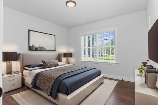 17501 Julianne Dr, Waller, TX 77484 - bedroom featuring dark wood-style flooring and baseboards