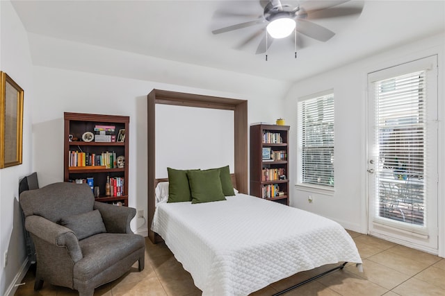 8817 Lakeshore Bend Dr, Houston, TX 77080 - bedroom with access to exterior, light tile patterned flooring, ceiling fan, and baseboards