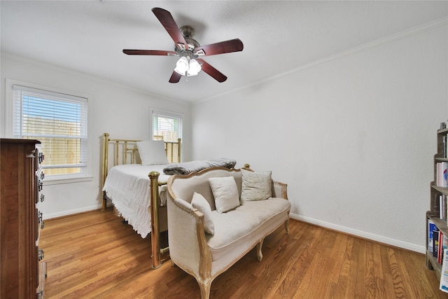 1635 Althea Dr, Houston, TX 77018 - bedroom featuring baseboards, light wood-type flooring, ornamental molding, and a ceiling fan
