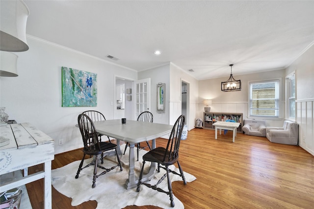 1635 Althea Dr, Houston, TX 77018 - dining space featuring a chandelier, light wood-style flooring, crown molding, and recessed lighting