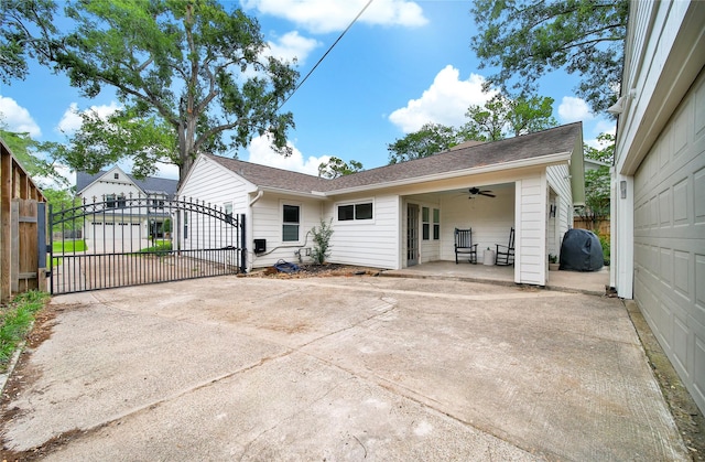 1635 Althea Dr, Houston, TX 77018 - back of property with a gate, a ceiling fan, roof with shingles, and a patio