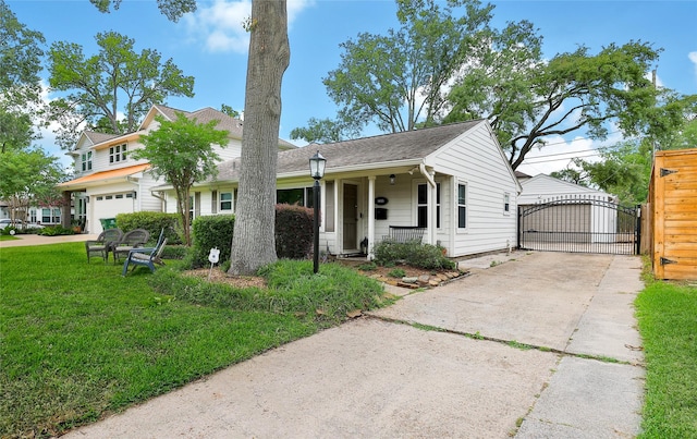 1635 Althea Dr, Houston, TX 77018 - view of front of property with a gate, a garage, a porch, a front lawn, and concrete driveway