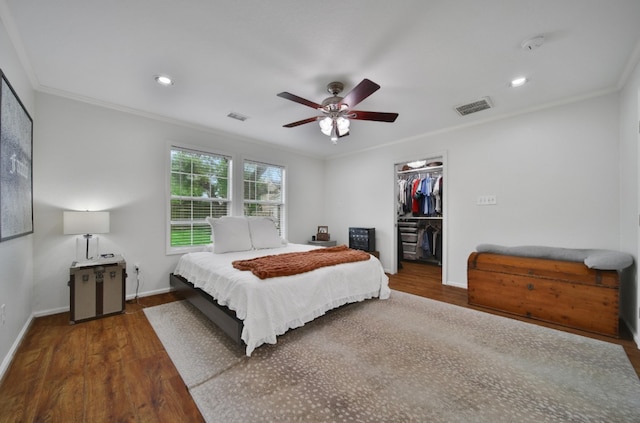 1635 Althea Dr, Houston, TX 77018 - bedroom with wood finished floors, crown molding, baseboards, a spacious closet, and ceiling fan