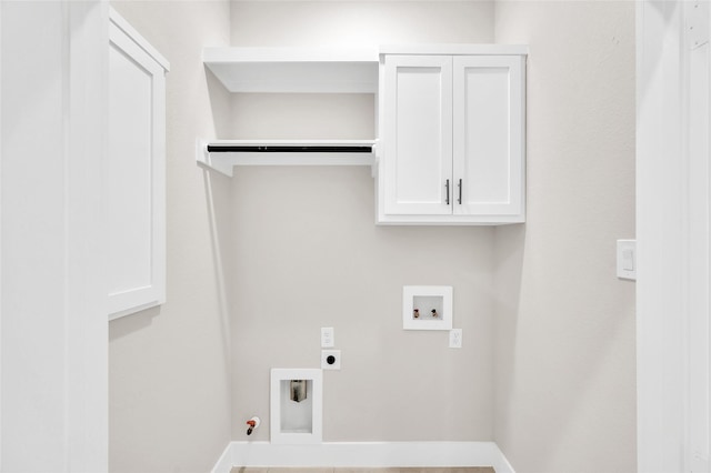 8714 Clarington St, Houston, TX 77016 - laundry room with electric dryer hookup, hookup for a washing machine, hookup for a gas dryer, cabinet space, and baseboards