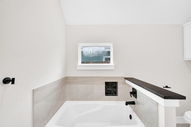8714 Clarington St, Houston, TX 77016 - bathroom with a garden tub and toilet